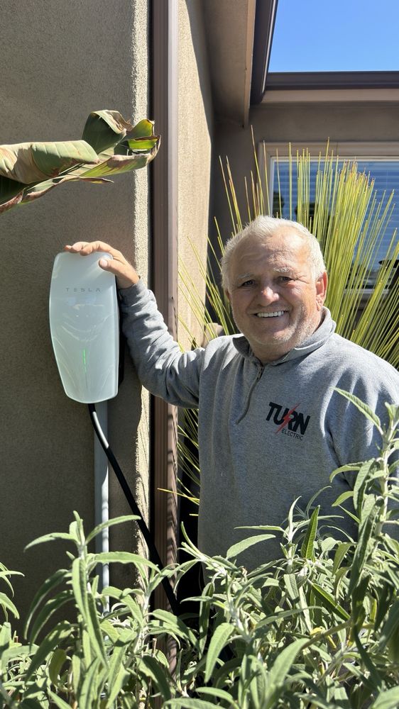 Turn Electric electrician with a completed Tesla charger installation